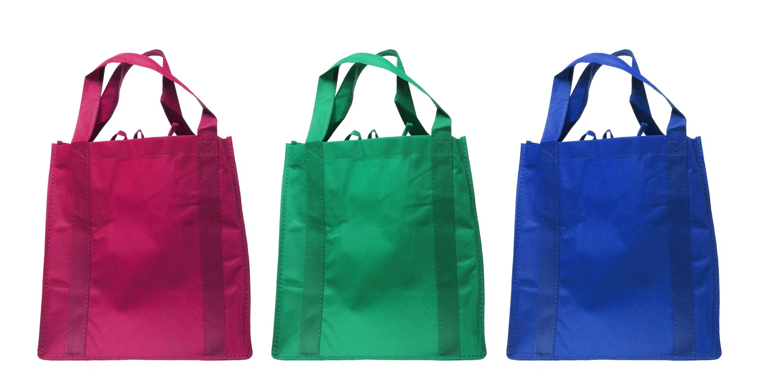 Welpac packaging company Three colorful shopping bags on a welpac packaging company white background.