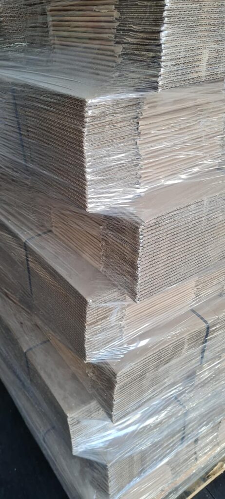 Welpac packaging company A stack of cardboard boxes, sourced from a reliable supplier, stacked on top of each other.
