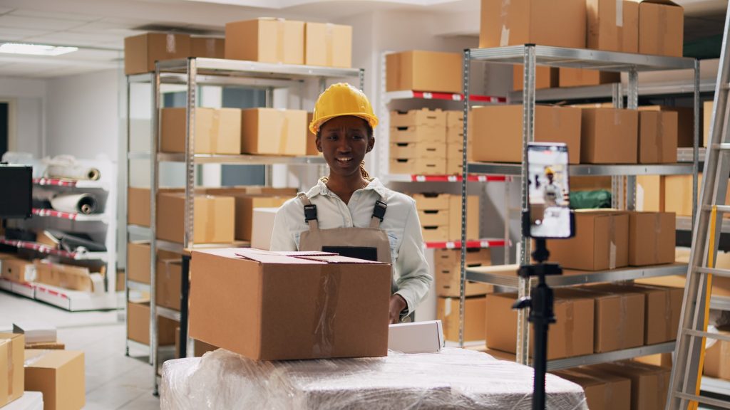 Young supervisor advertising goods in packages