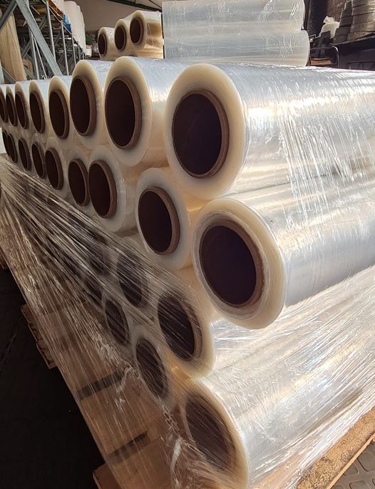 Welpac packaging company A sustainable large roll of plastic wrap sitting on a pallet.