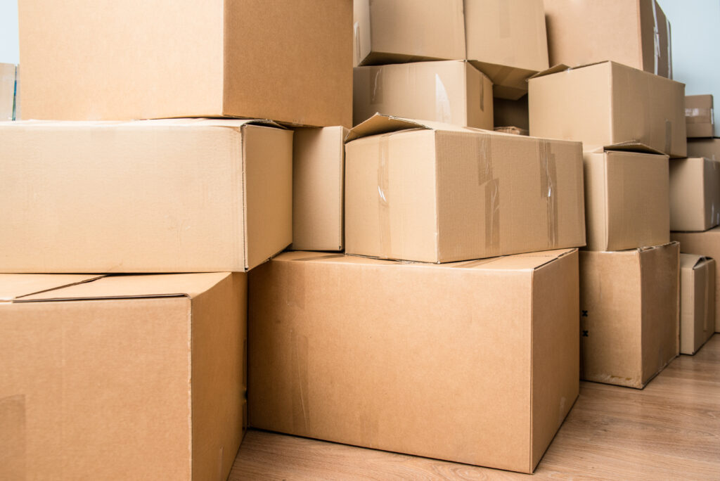 Welpac packaging company A pile of cardboard boxes in a room. Have you ever wondered who offers specialized packaging solutions for fragile items?