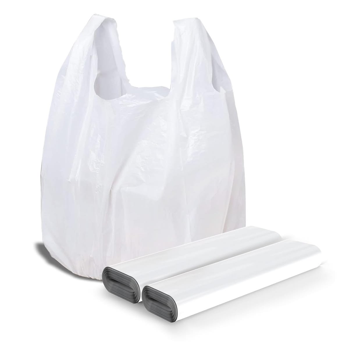 A white plastic shopping bag is shown standing upright next to two rolls of unused plastic bags, highlighting practical packaging supplies for everyday solutions.